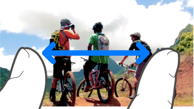 An illustration of pinching with two fingers to zoom in or out.