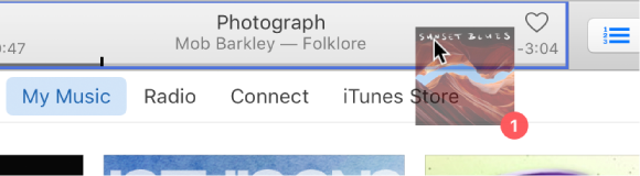 An album being dragged to the top of the iTunes window