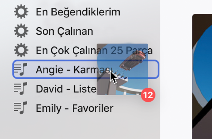 Bir listeye sürüklenmiş bir albüm. Liste mavi bir dikdörtgen ile vurgulanır.