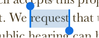 Selection handles around a word.